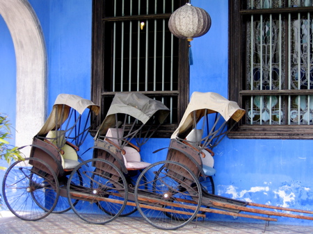 'Rickshaws in front of Cheong Fatt Tze Mansion in Penang'